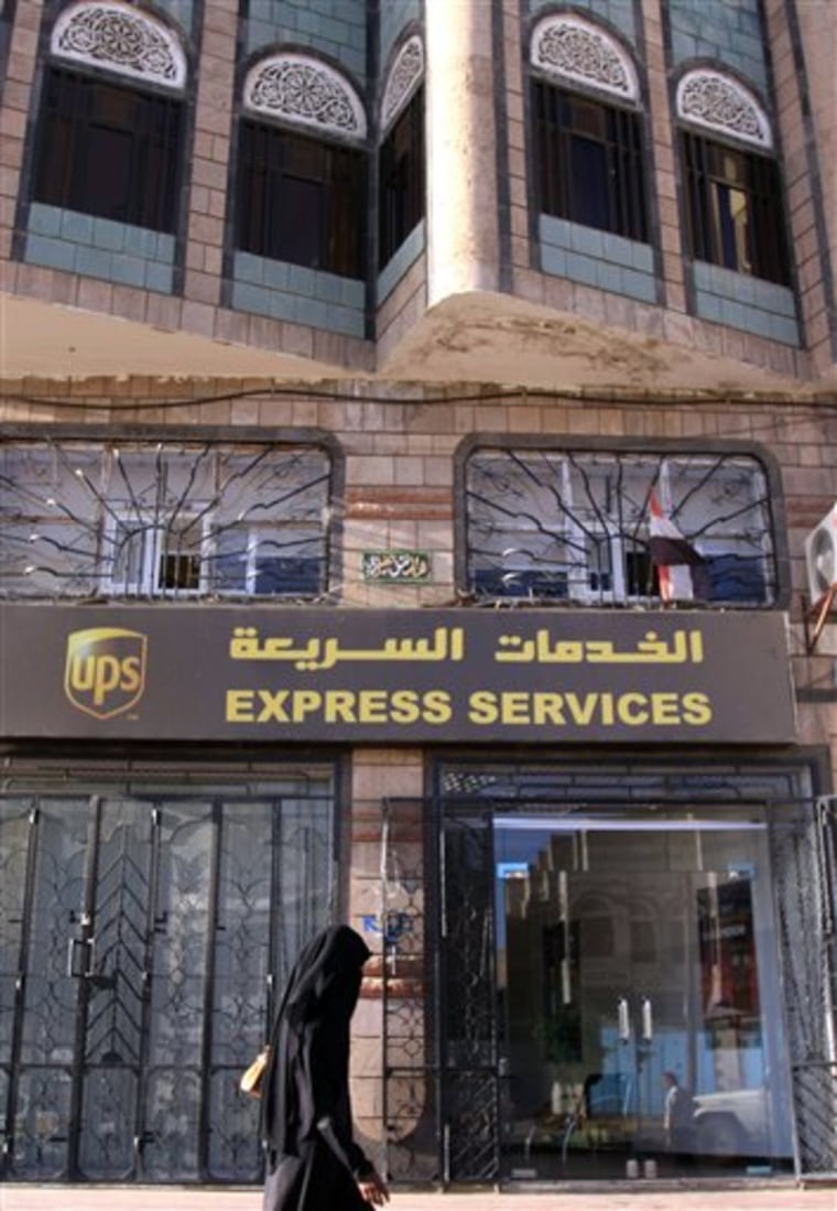 An unidentified Yemeni woman walks past the UPS office Saturday, Oct. 30, 2010, in San'a, Yemen. Yemeni authorities are checking dozens more packages in the search for those who tried to mail bombs to Chicago-area synagogues in a brazen plot that heightened fears of a new al-Qaida terror attack. (AP Photo/Hasan Jamali)